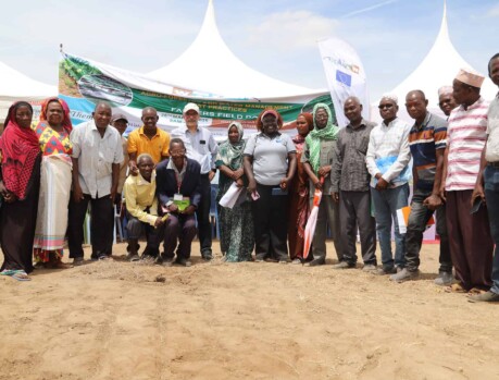 Participants at the Training and Innovation Roadshow in Hola gather for a group photo, emphasizing community engagement in development initiatives. Community members at the Training and Innovation Roadshow in Hola, promoting development and technol.
