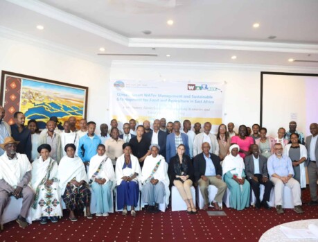 Group photo of participants at the local feedback meeting in Addis Ababa, focusing on water management and farm development. Community feedback meeting in Addis Ababa with farm visit and water management discussions.